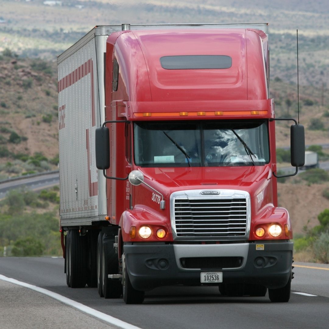 red semi-truck on highway